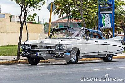 White taxi classic car on the street in Cuba Editorial Stock Photo