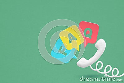 telephone icon and FAQ , frequency asked question, speech bubble paper cut on grunge green background with copy space for Stock Photo