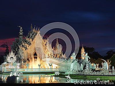 The White Temple with amazed sunset sky Stock Photo