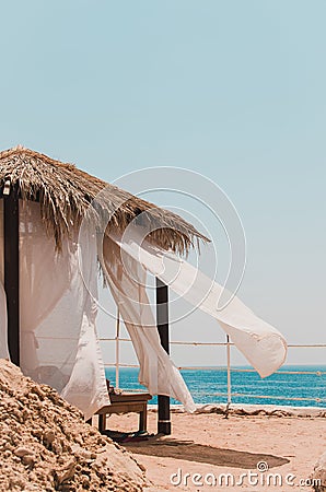 White tent on the beach Stock Photo