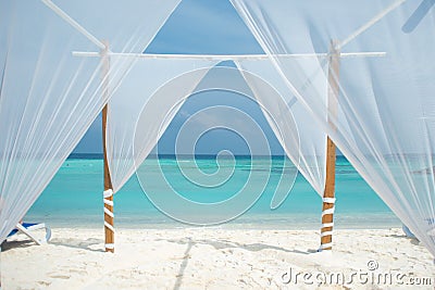 White tent for wedding ceremonies or romantic evening on a maldivian island. Stock Photo