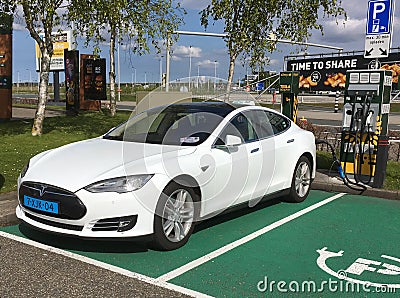 White Tesla taxi charging Editorial Stock Photo