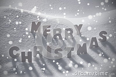 White Text Merry Christmas On Snow, Snowflakes Stock Photo