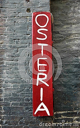 White Text OSTERIA that means TAVERN in Italian language and old wall Stock Photo