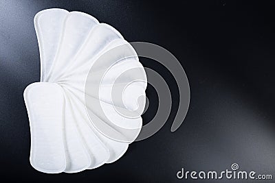 Many panty liners on black. Thin pads with copy space Stock Photo