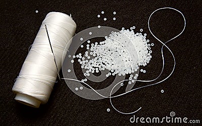 White thread with glass beads Stock Photo