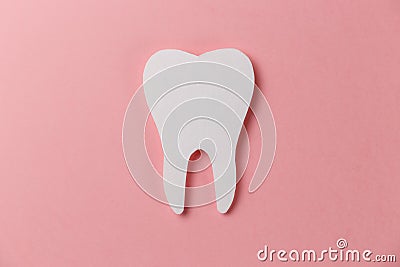 White tooth on pink background Stock Photo