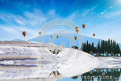 White travertine terrace formations, pool with clear hot water from thermal springs in Pamukkale, Denizli Province in southwestern Stock Photo