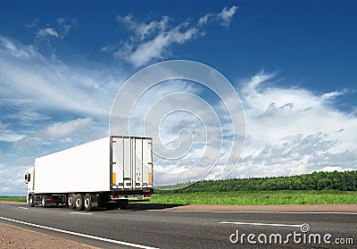 White truck speeding away on highway Stock Photo