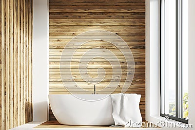 White tub, wooden room, window, front Stock Photo