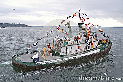 White Tugboat , sails to start of race Editorial Stock Photo