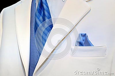 White tuxedo with blue tie and vest Stock Photo