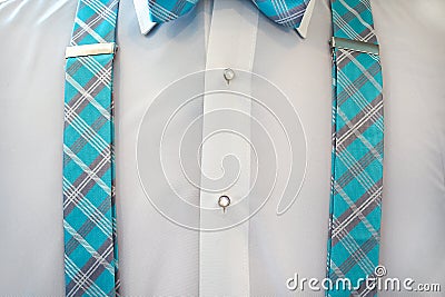 White tuxedo shirt with suspenders Stock Photo