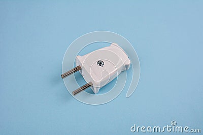 White two pronged plug on a blue background Stock Photo