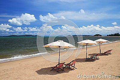 White umbrella and colorful chair is relax vacation Stock Photo