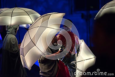 White umbrellas illuminated by led lamps in the night Editorial Stock Photo