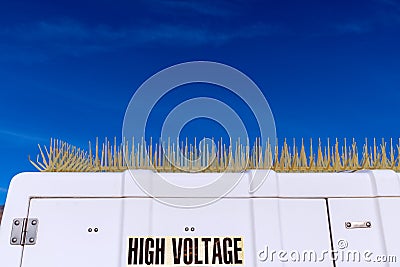 White utility building with plastic bird spikes Stock Photo
