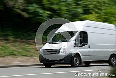 White Van Moving Fast Stock Photo