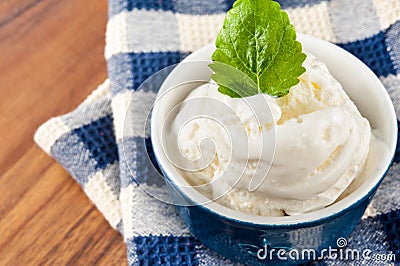 White vanilla ice-cream with green mint. Closeup. Stock Photo