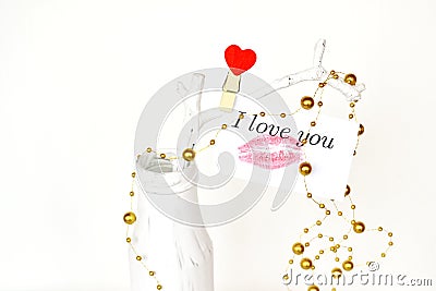 White vase with branch and card with lipstick kiss and the words I love you. Wedding, Valentine's day background Stock Photo