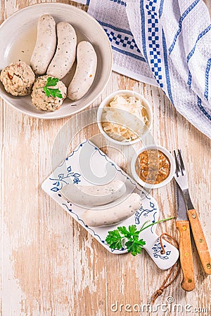 White veal sausage Weisswurst with pickled white sour cabbage Sauerkraut and bread dumplings Knodel Stock Photo