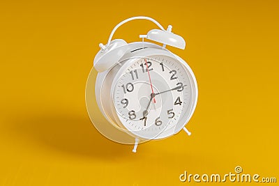 White vintage alarm clock on bright orange color background. Time management, deadline concept. 3d rendering Cartoon Illustration