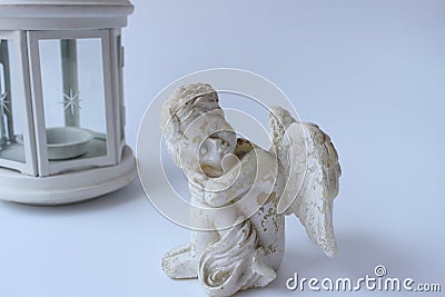 White vintage Angel sits on a white background Stock Photo