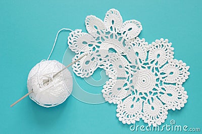 White vintage crochet doily. Cotton yarn for knitting, crochet hook Stock Photo