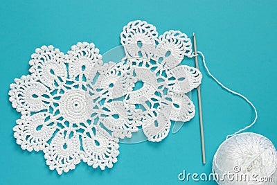 White vintage crochet doily. Cotton yarn for knitting, crochet hook Stock Photo