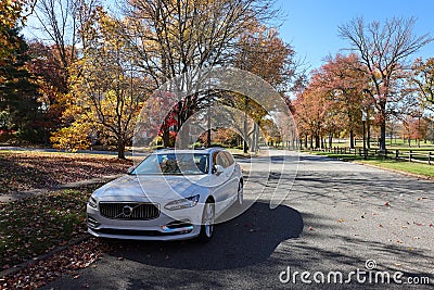 A white Volvo V90 inscription station wagon parked on a community street in Wilmington, Delaware in autumn Editorial Stock Photo