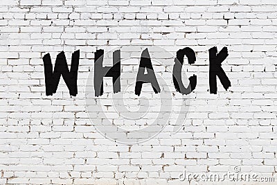 White wall with black paint inscription whack on it Stock Photo