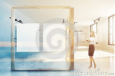 White and wooden poster gallery, woman Stock Photo