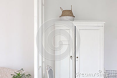 White wardrobe and chair Stock Photo