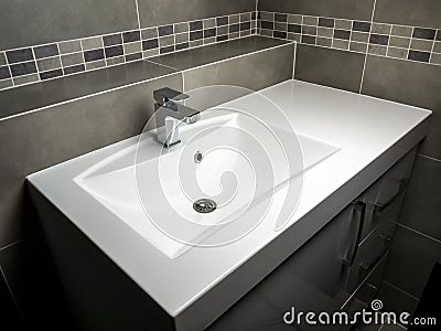 White washbasin with chrome faucet Stock Photo