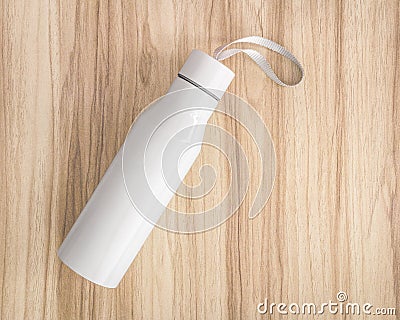 White water bottle on wood background. Insulated container for keep your drink. Stock Photo