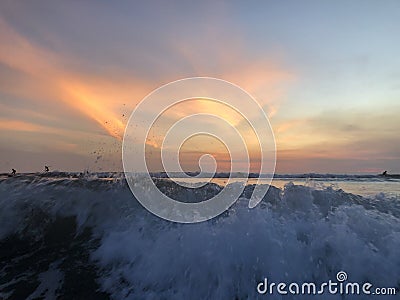 White waves at Kuta sunset Stock Photo