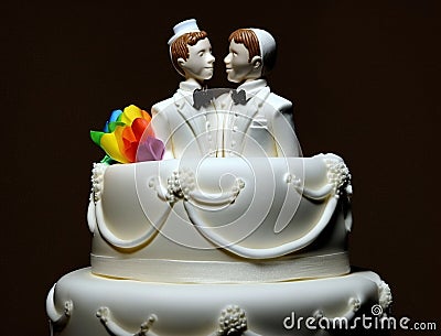 White wedding cake and gay couple on top. two grooms will marry. Stock Photo