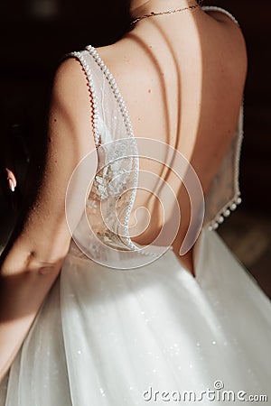 white wedding dress about bare back bride Stock Photo