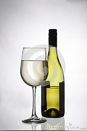 White wine in a glass and bottle Stock Photo