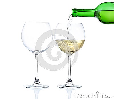 White wine poured into glass Stock Photo