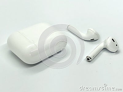 White Wireless Earbuds Out of Case Stock Photo