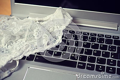 White woman panties with laptop- computer Stock Photo