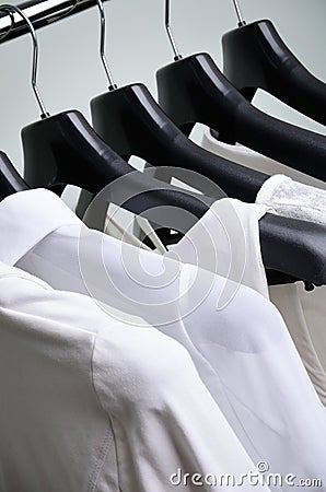 White womens clothing hanging vertical Stock Photo