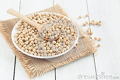 White wood floor cup with soybean,soybeans in white bowl with wooden spoon on table wooden Stock Photo