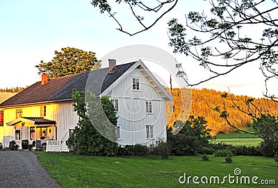 White wooden scandinavian house on sunset Stock Photo