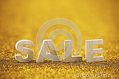 Word sale over golden glitter background Stock Photo