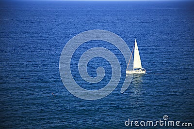 White yacht in a deep blue sea Editorial Stock Photo