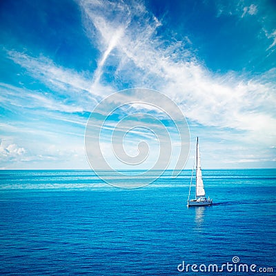 White Yacht Sailing in Blue Sea Stock Photo