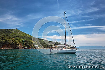 White Yacht in the sea near the island. Stock Photo