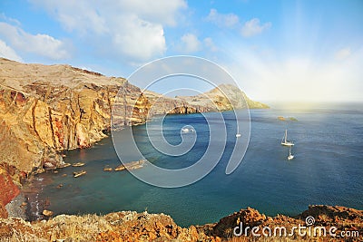 The white yachts in the rocky gulf Stock Photo